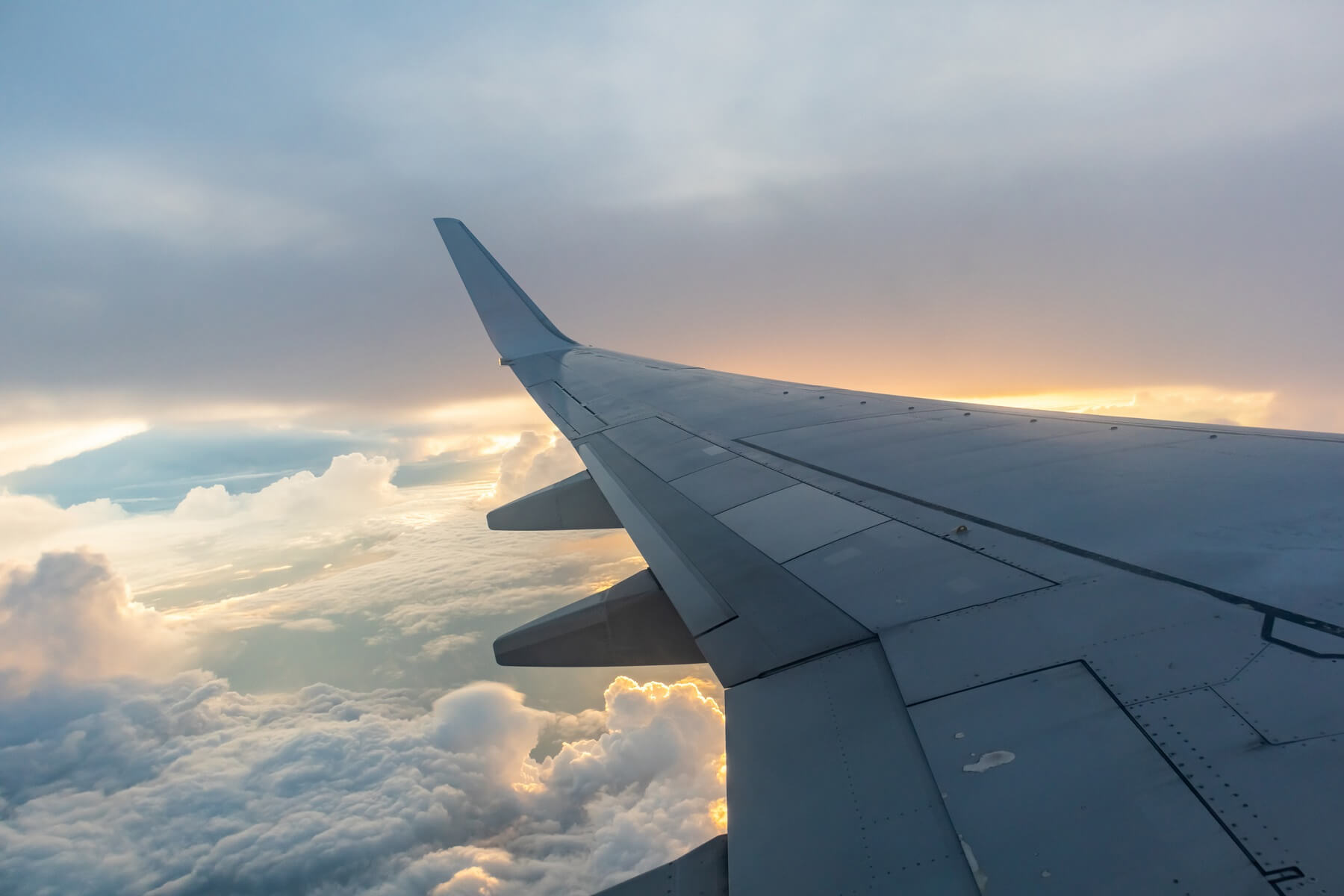 Airplane flying above the clouds